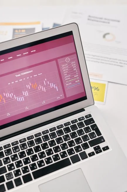 A top view on charts and smartphone in an office, showcasing data analytics.